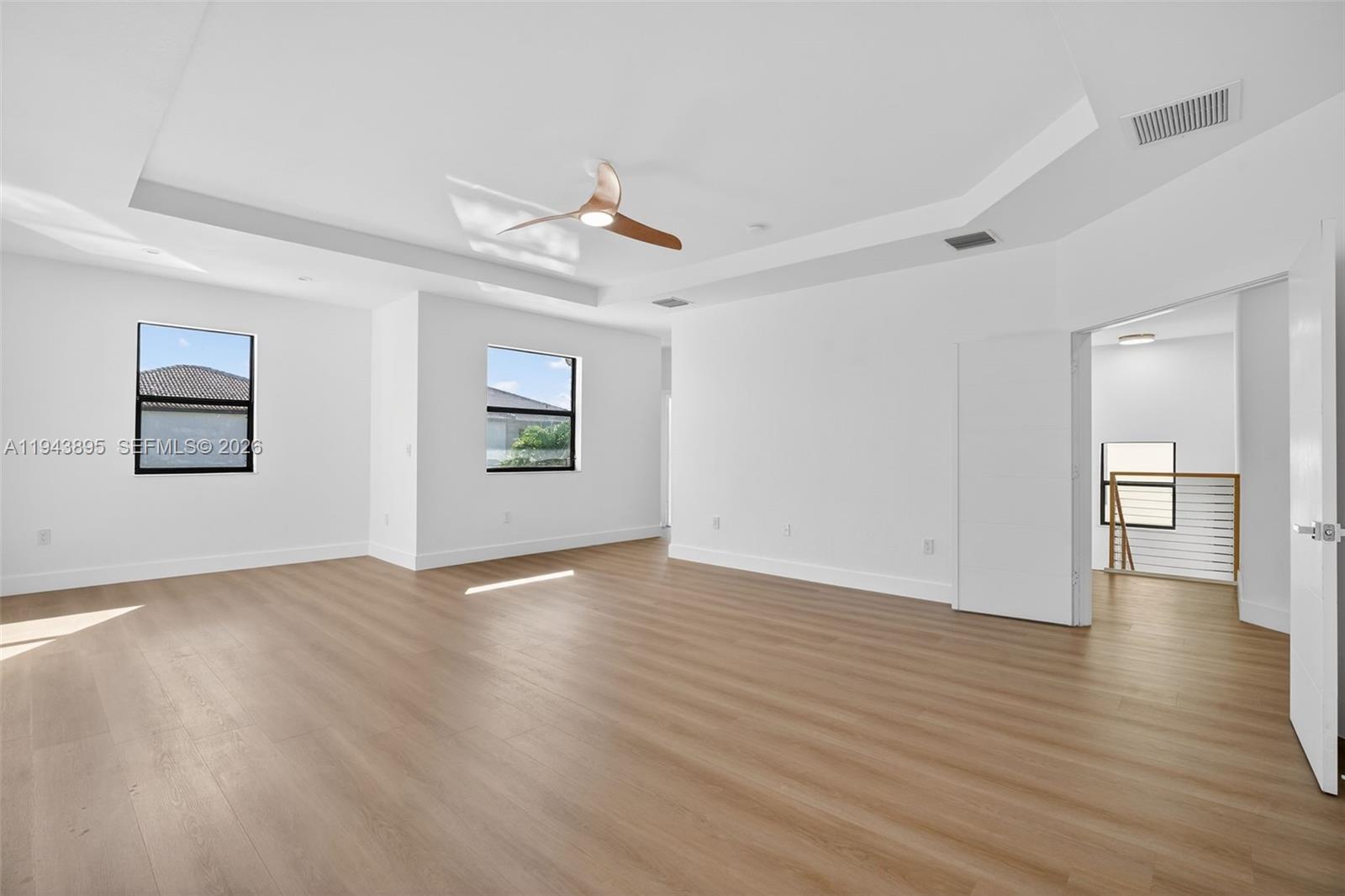 11556 Southwest 234th Street Homestead, FL 33032 - Photo 19 of 44 a view of an empty room with wooden floor and a window