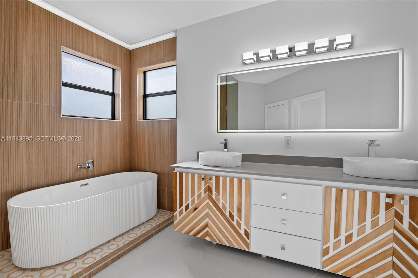 11556 Southwest 234th Street Homestead, FL 33032 - Photo 22 of 44 a bathroom with a sink double vanity and a bathtub