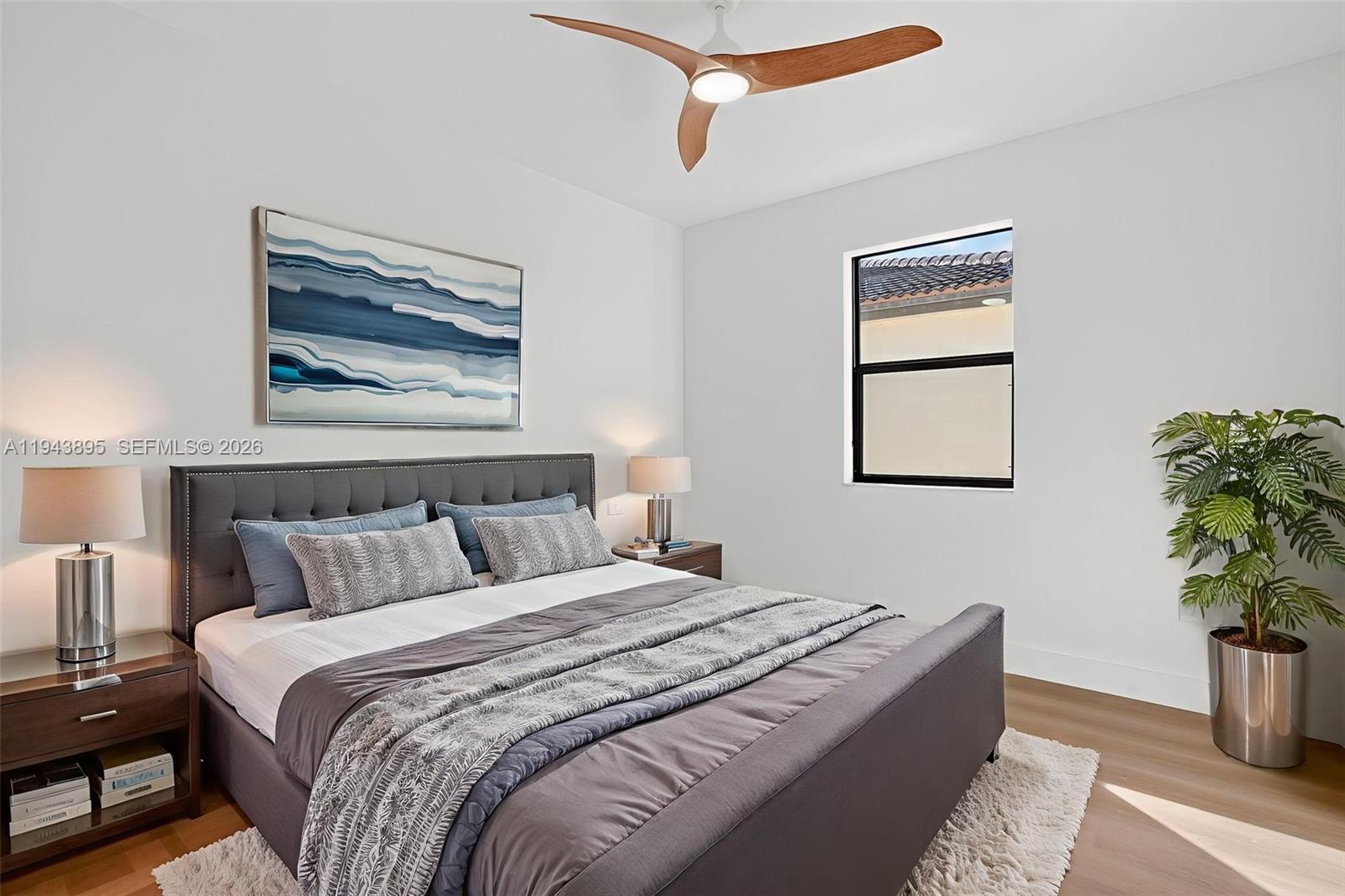 11556 Southwest 234th Street Homestead, FL 33032 - Photo 24 of 44 a bedroom with bed and a potted plant