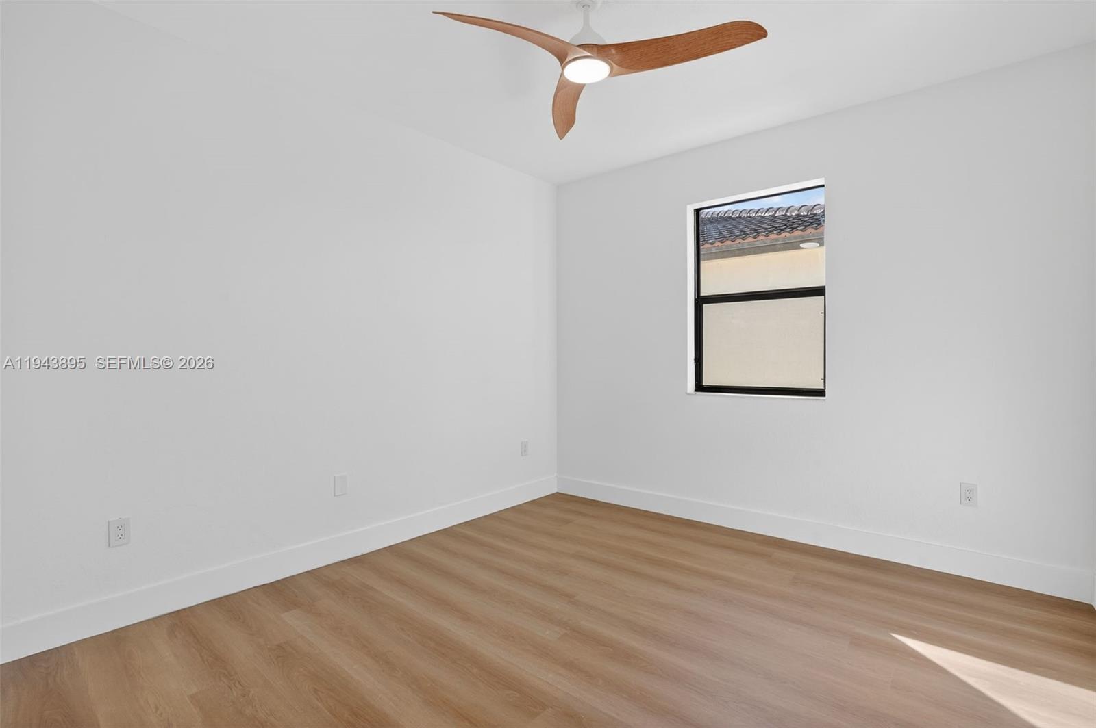 11556 Southwest 234th Street Homestead, FL 33032 - Photo 25 of 44 a view of a room with wooden floor and fan