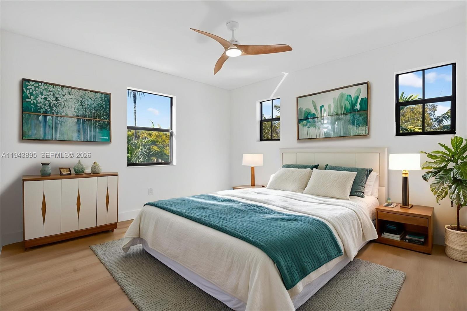 11556 Southwest 234th Street Homestead, FL 33032 - Photo 26 of 44 a bedroom with a large bed and a window