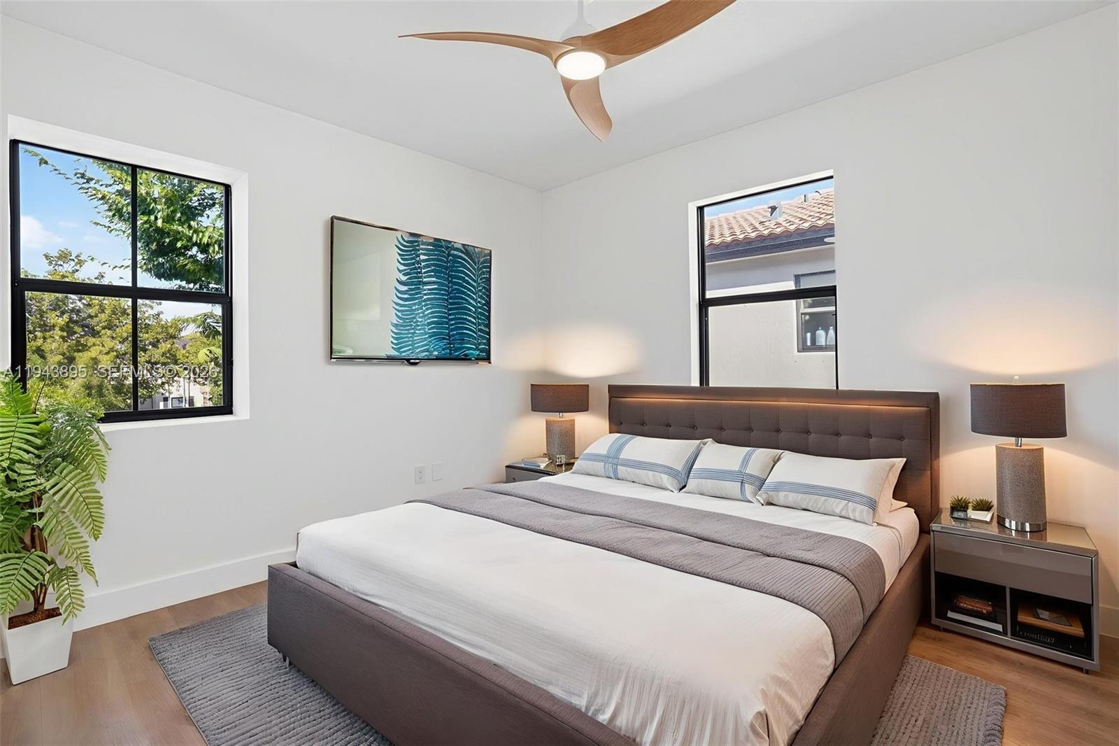 11556 Southwest 234th Street Homestead, FL 33032 - Photo 28 of 44 a bedroom with a bed and a window