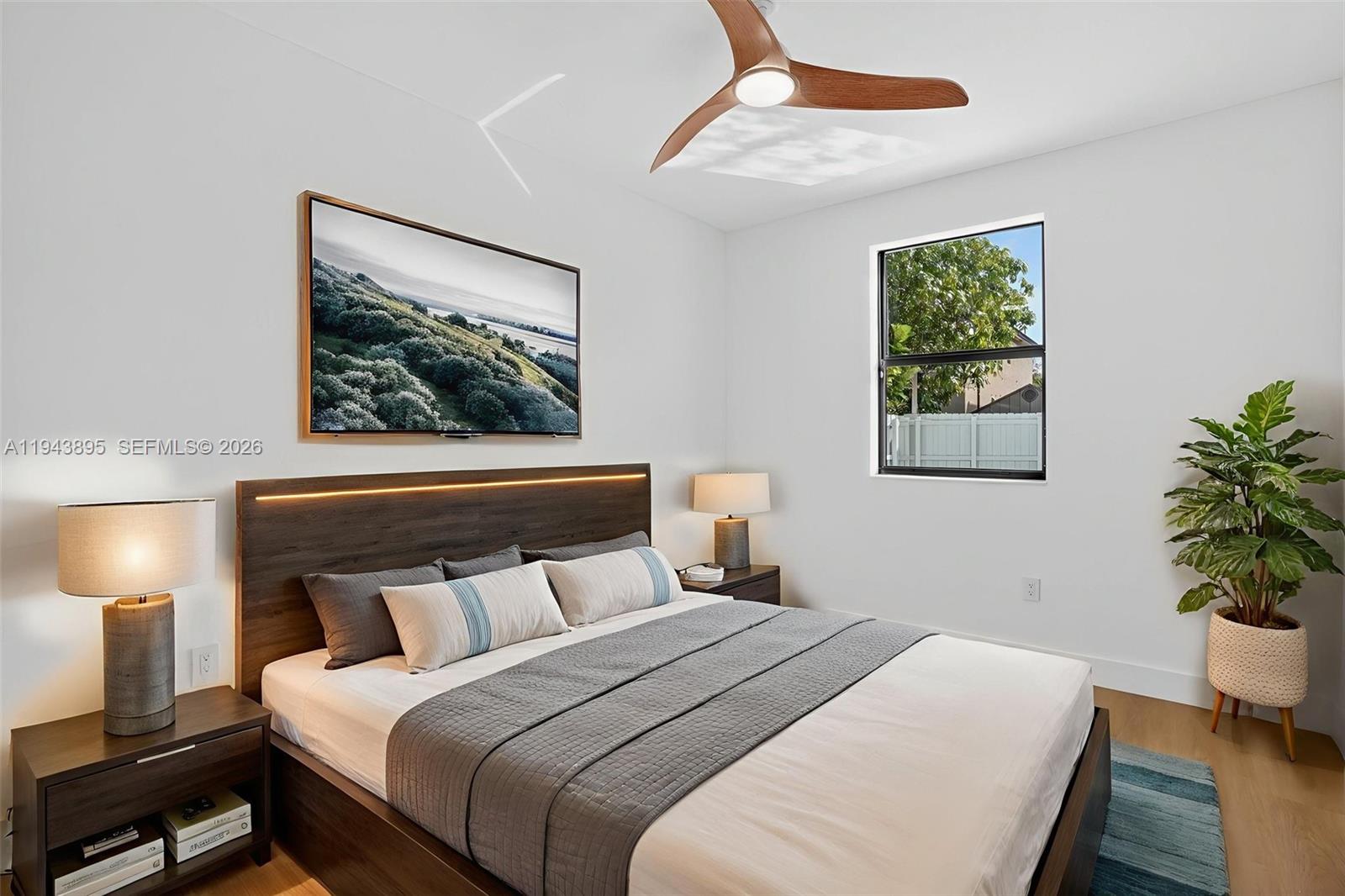 11556 Southwest 234th Street Homestead, FL 33032 - Photo 30 of 44 a bedroom with bed and a potted plant