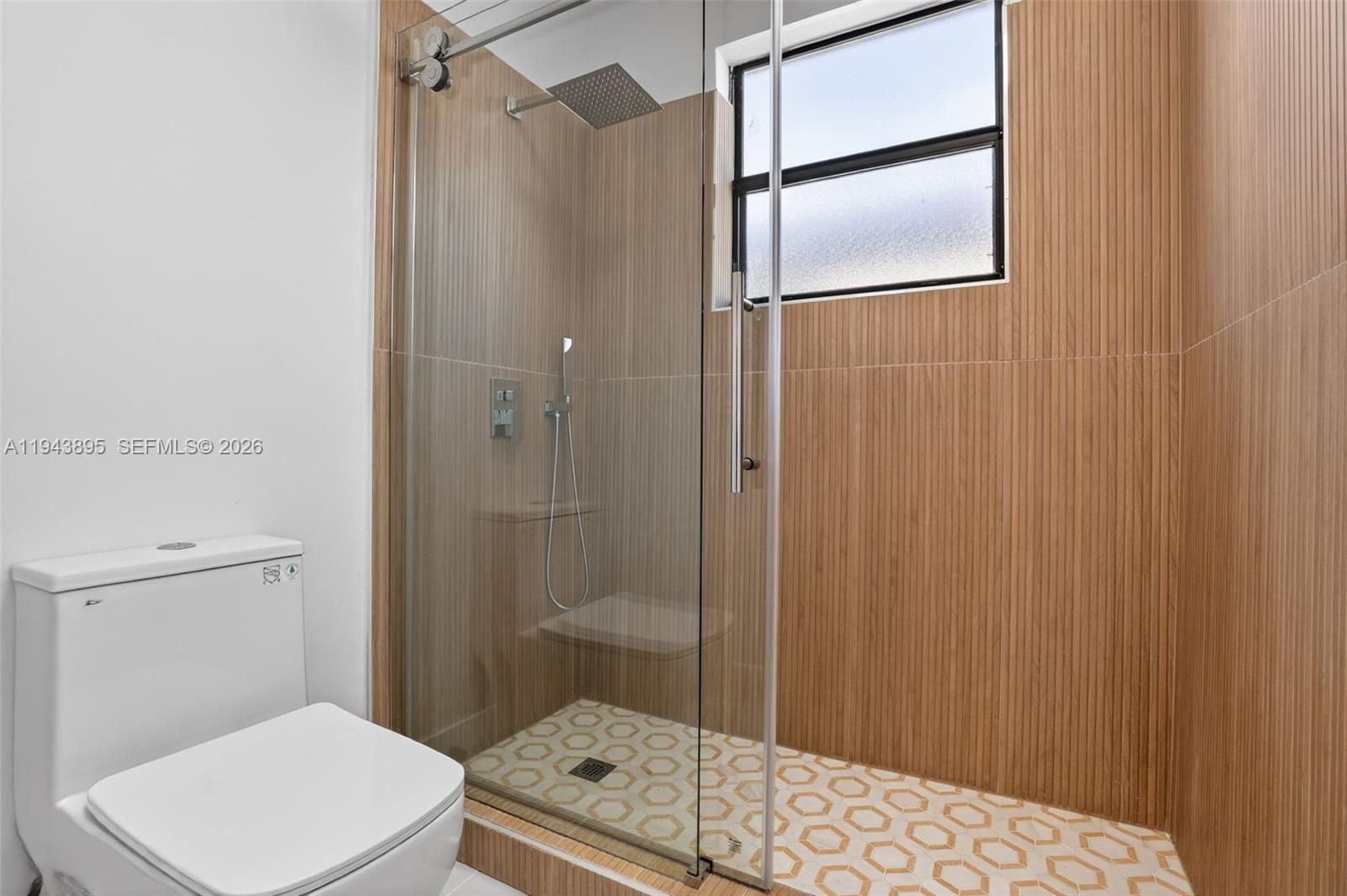 11556 Southwest 234th Street Homestead, FL 33032 - Photo 33 of 44 a bathroom with a toilet and a shower