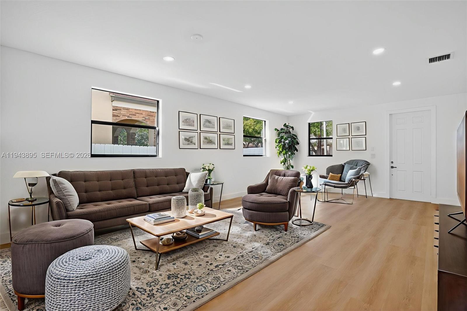 11556 Southwest 234th Street Homestead, FL 33032 - Photo 7 of 44 a living room with furniture a rug and a window