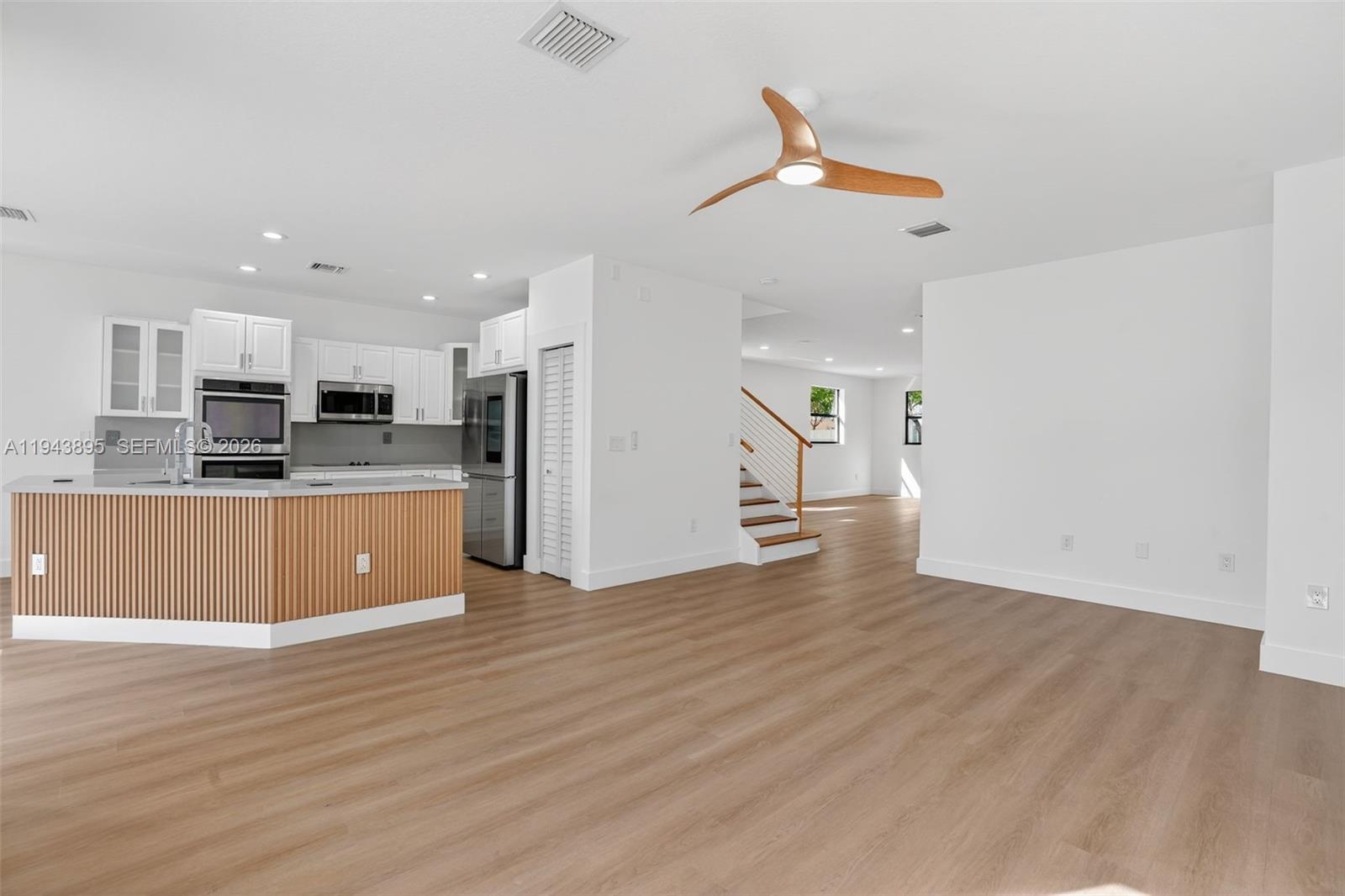 11556 Southwest 234th Street Homestead, FL 33032 - Photo 9 of 44 a view of kitchen with wooden floor
