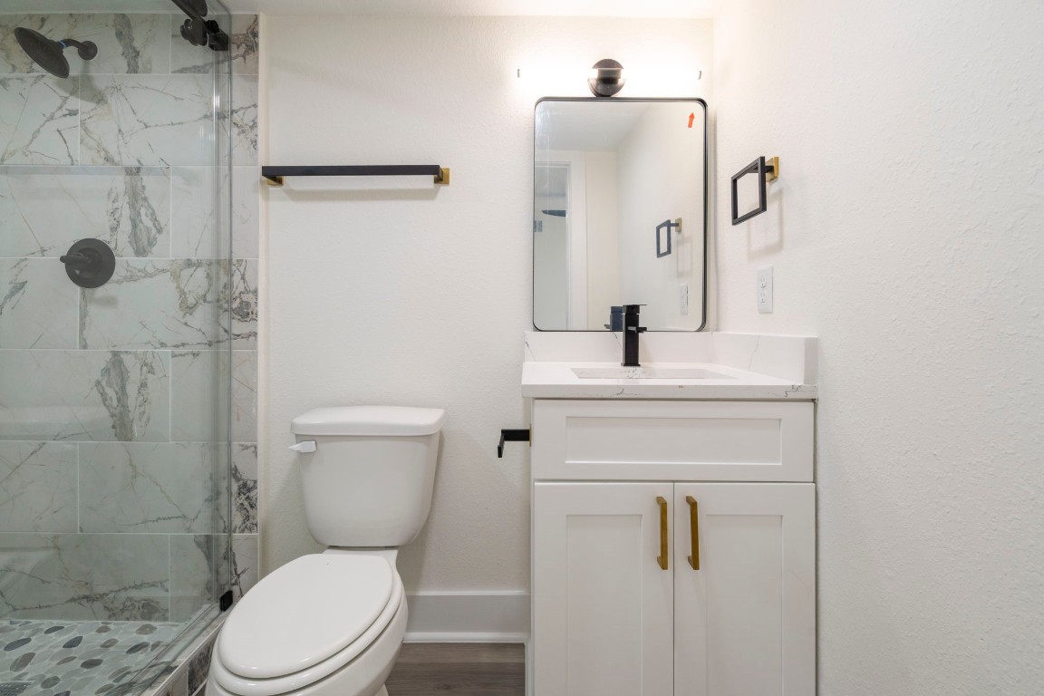 2817 Winbern Street Houston, TX 77004 - Photo 12 of 23 a bathroom with a sink toilet and shower