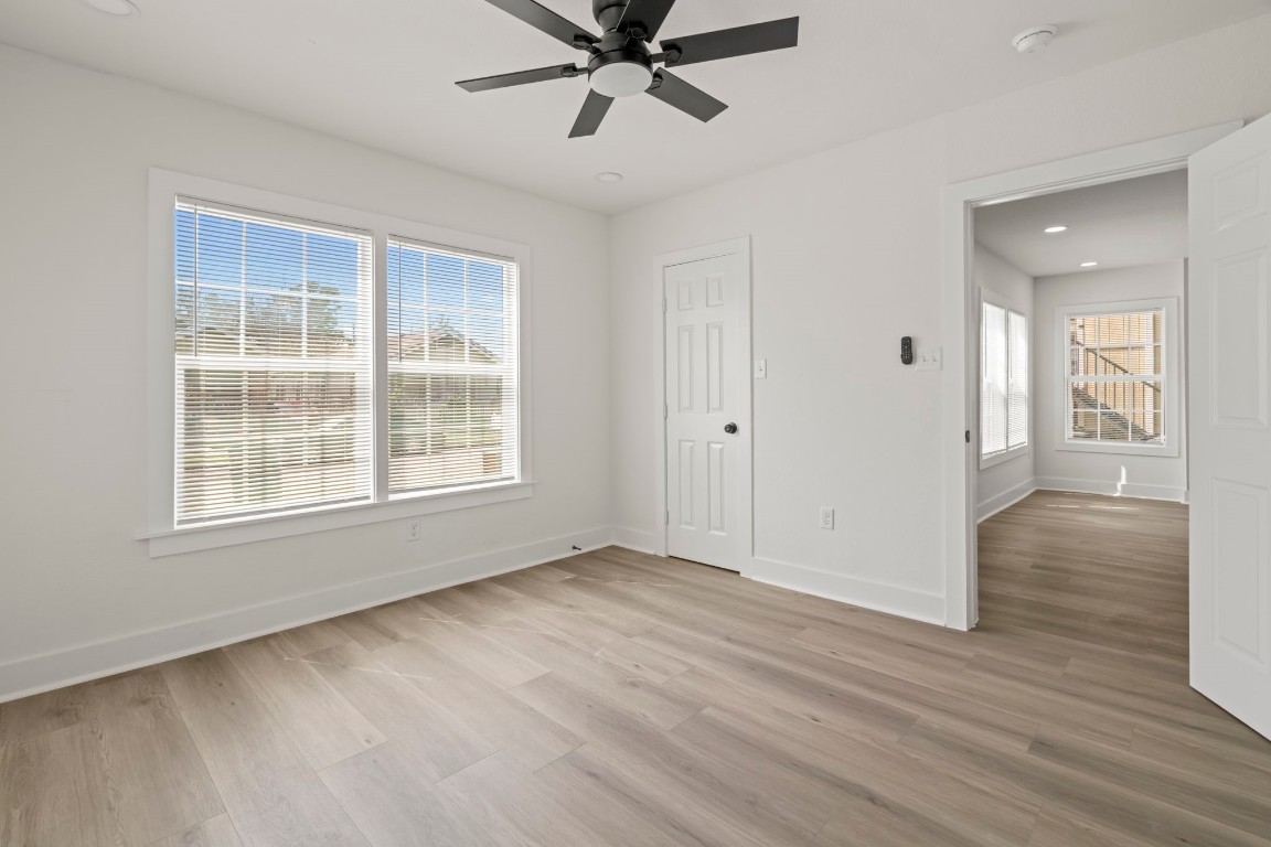 2817 Winbern Street Houston, TX 77004 - Photo 13 of 23 wooden floor in an empty room with a window