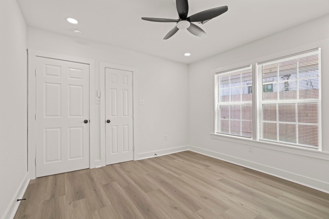 2817 Winbern Street Houston, TX 77004 - Photo 17 of 23 wooden floor in an empty room with a window
