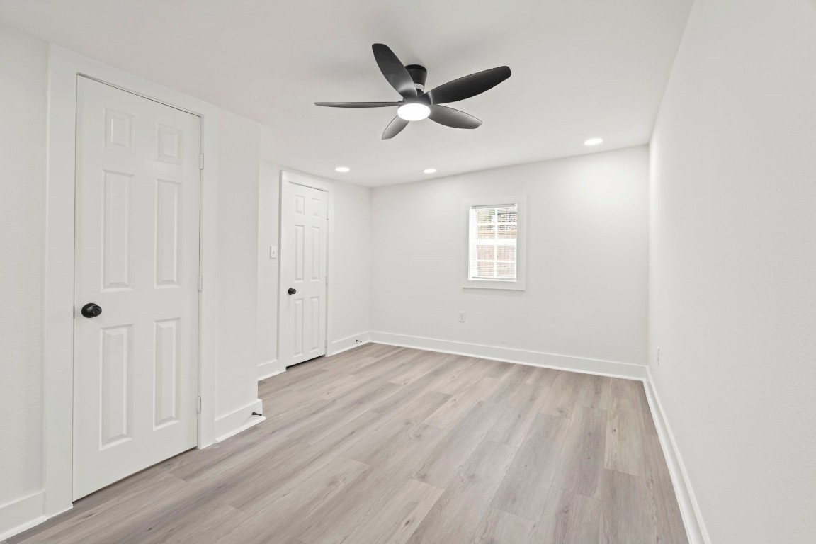 2817 Winbern Street Houston, TX 77004 - Photo 19 of 23 wooden floor in an empty room with a window