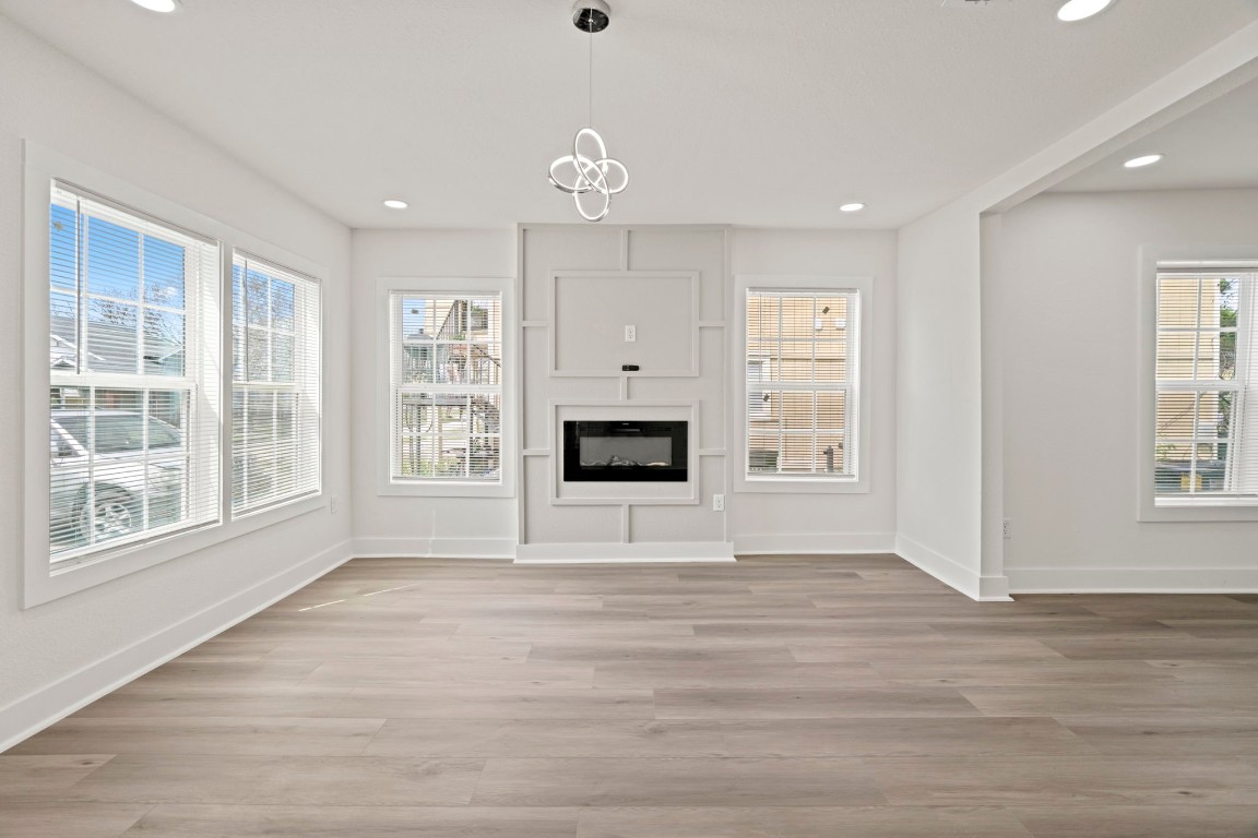 2817 Winbern Street Houston, TX 77004 - Photo 3 of 23 a view of an empty room with a window and a kitchen