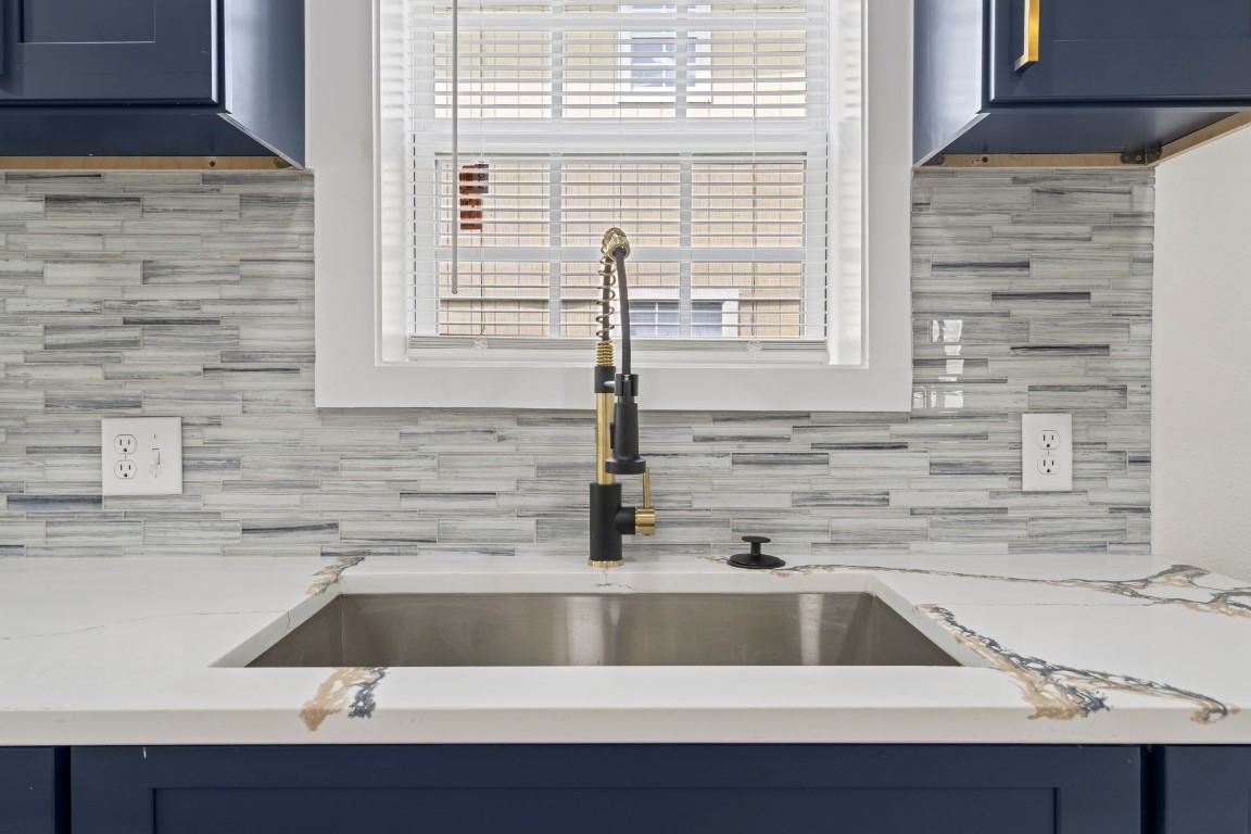 2817 Winbern Street Houston, TX 77004 - Photo 7 of 23 a kitchen with a sink and a window