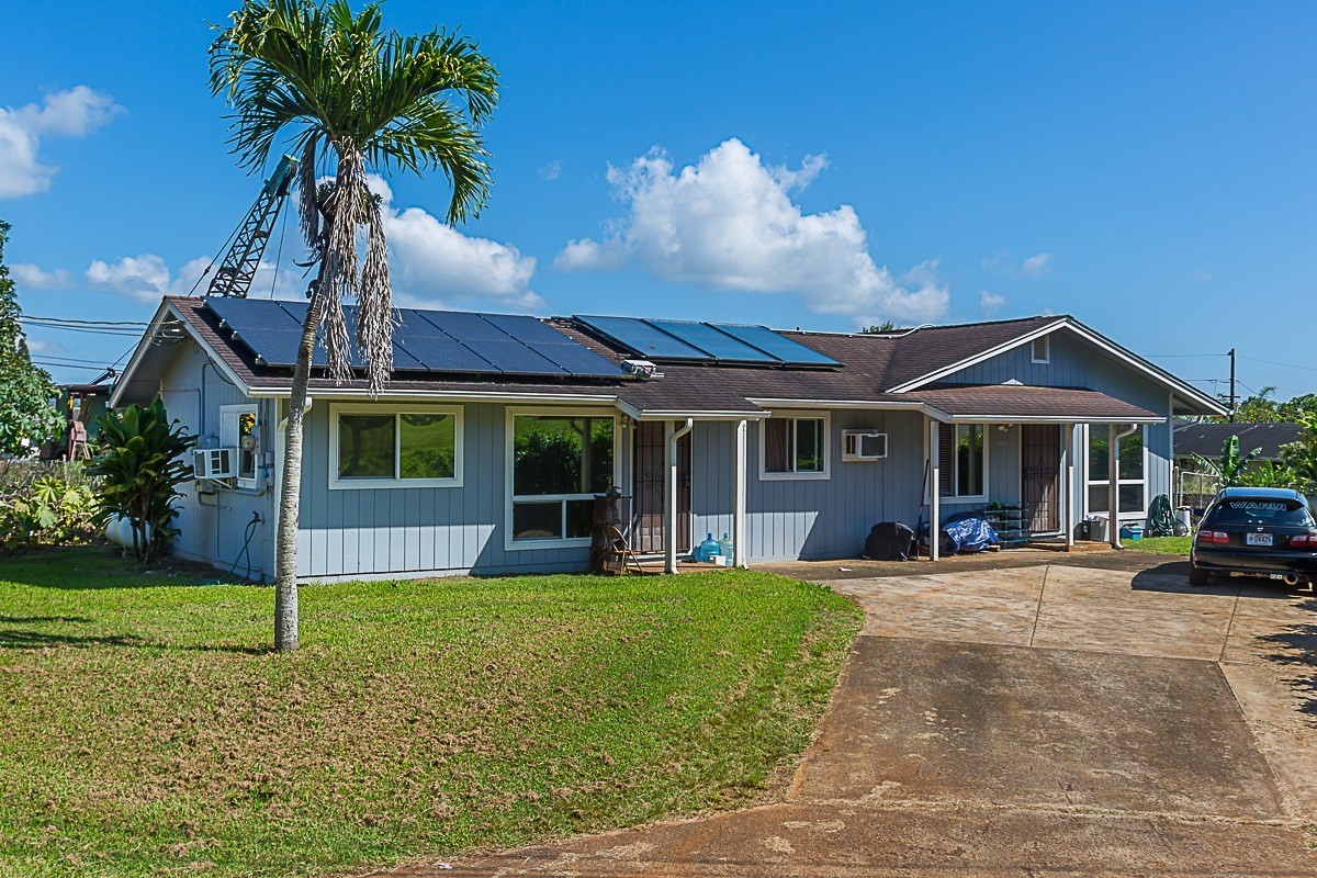3280 Hailima Road Koloa, HI 96756 - Photo 1 of 13 a view of a house with a yard and sitting area