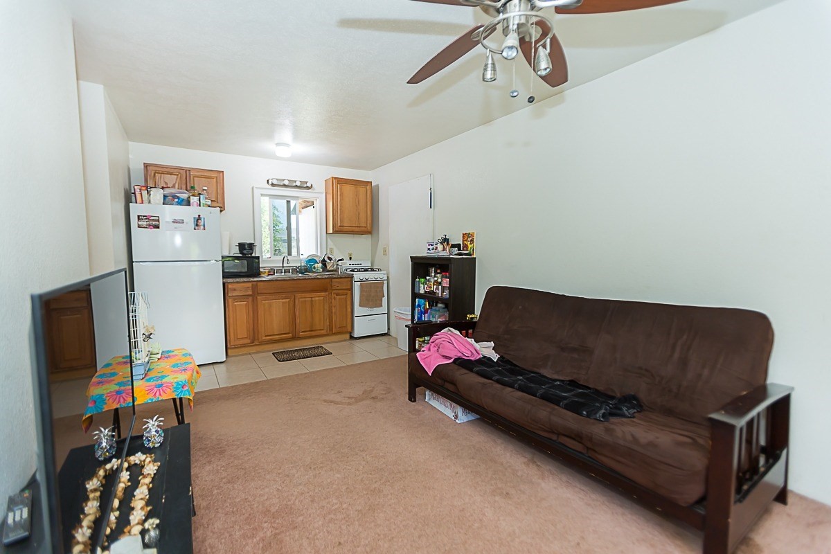 3280 Hailima Road Koloa, HI 96756 - Photo 3 of 13 a living room with furniture and a flat screen tv