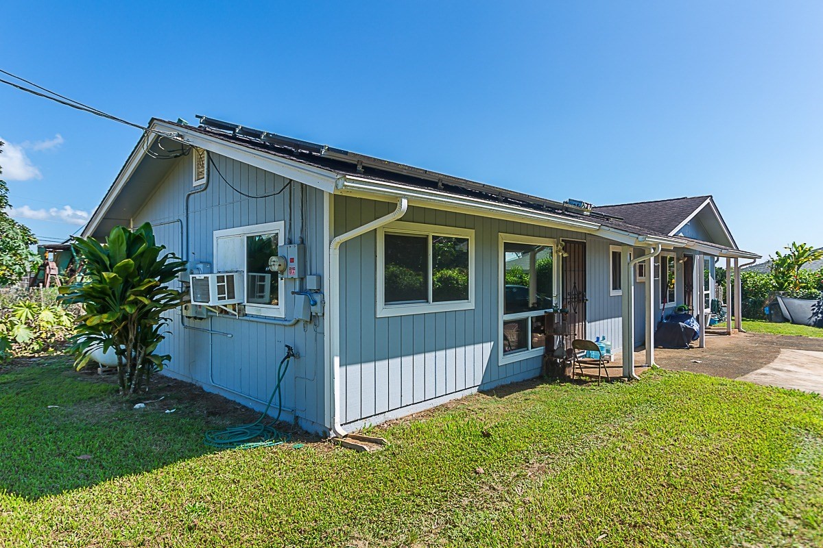 3280 Hailima Road Koloa, HI 96756 - Photo 5 of 13 a view of a house with backyard porch and sitting area