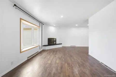 a bathroom with a granite countertop sink a large mirror and a shower