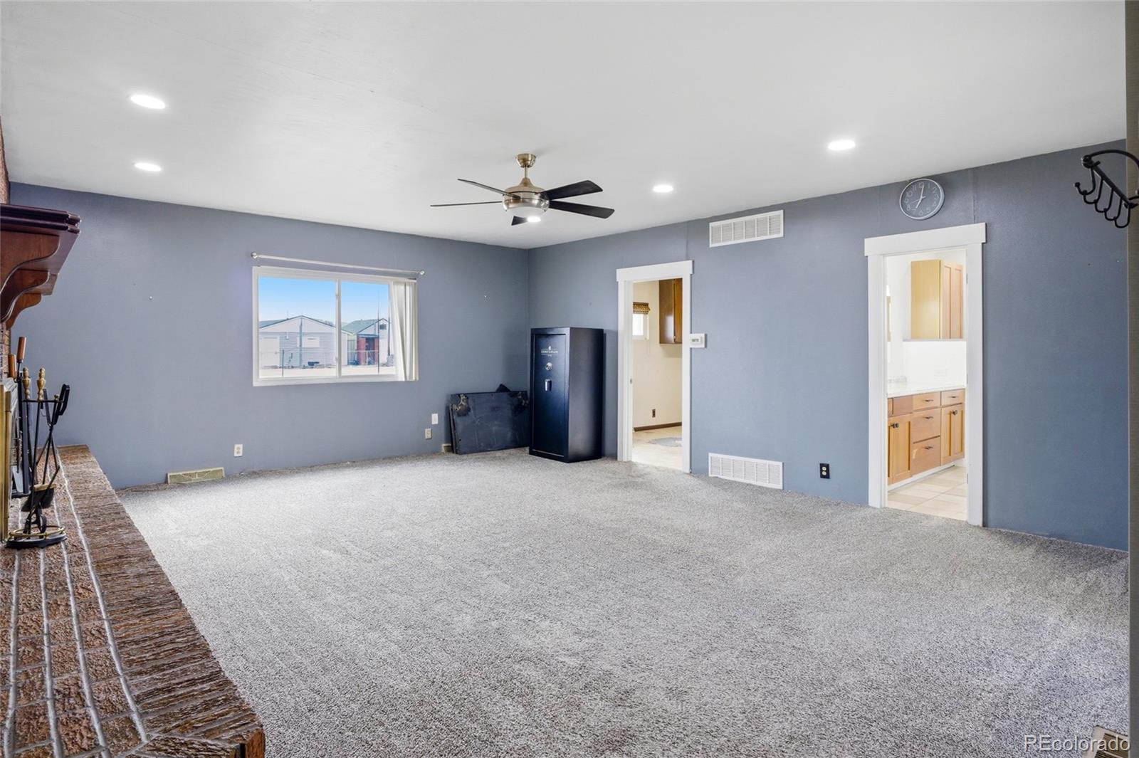 308 Fifth Street Dacono, CO 80514 - Photo 17 of 29 a view of an empty room with a window
