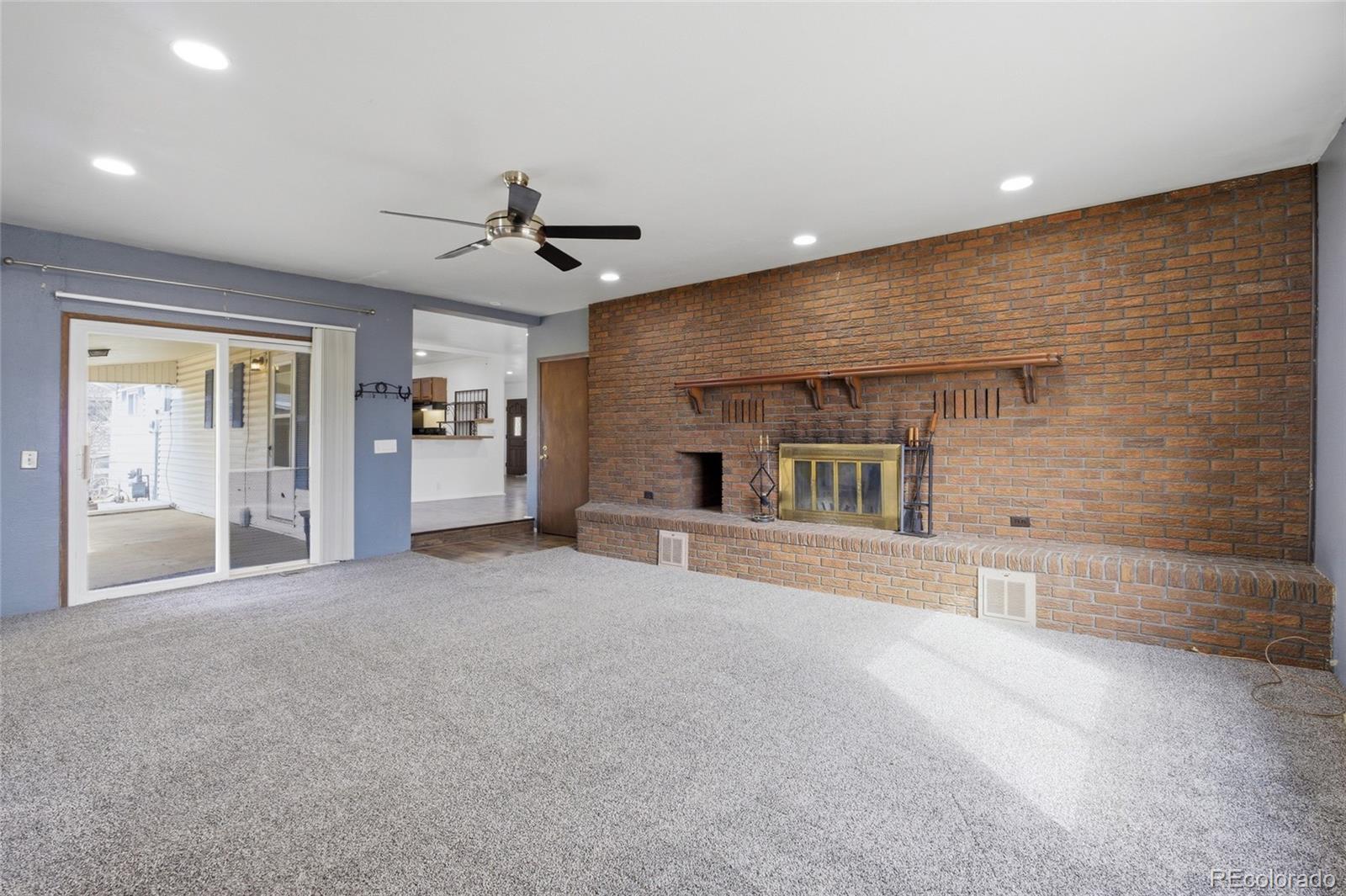 308 Fifth Street Dacono, CO 80514 - Photo 18 of 29 a view of a livingroom with a fireplace