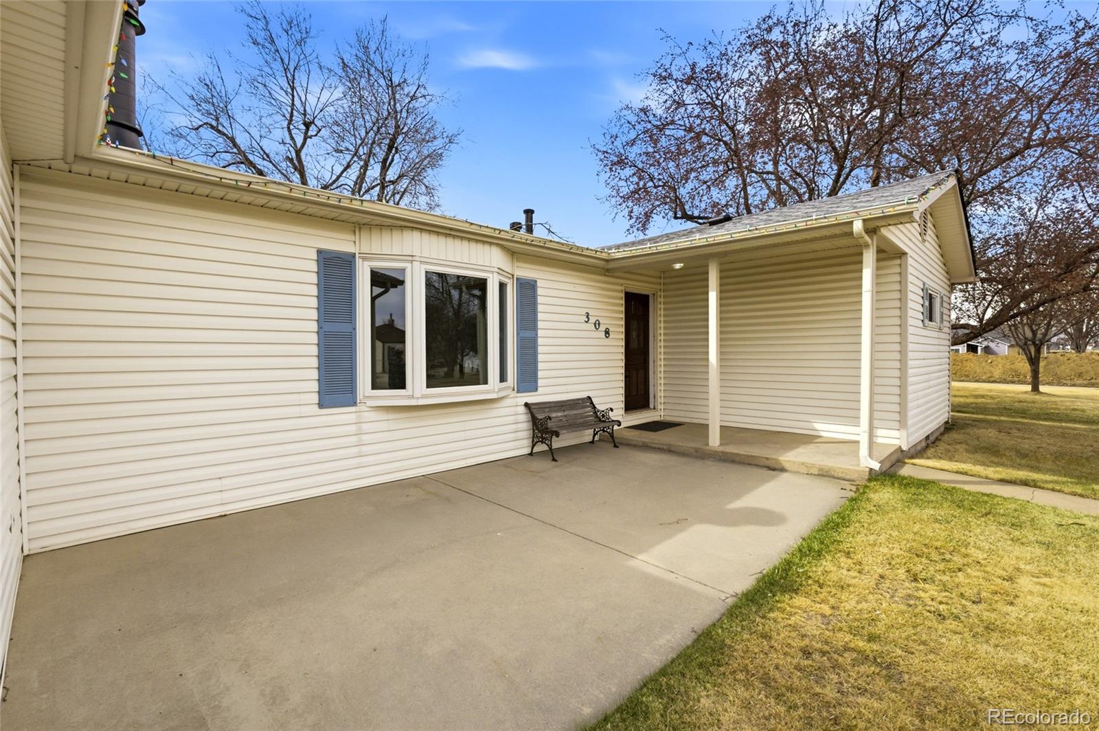 308 Fifth Street Dacono, CO 80514 - Photo 26 of 29 a view of a house with a patio