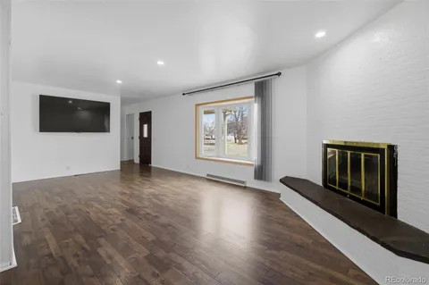 a view of a ceiling fan with wooden floor
