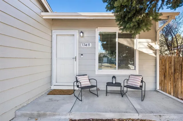a view of a two chairs in the patio