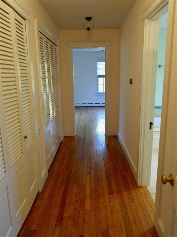 45 Bumblebee Hill Road Falmouth, MA 02540 - Photo 12 of 30 a view of a hallway with wooden floor and staircase