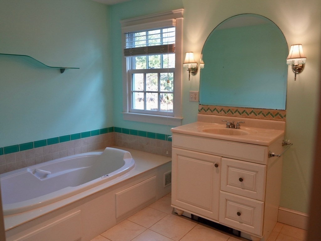 45 Bumblebee Hill Road Falmouth, MA 02540 - Photo 15 of 30 a bathroom with a tub sink and vanity