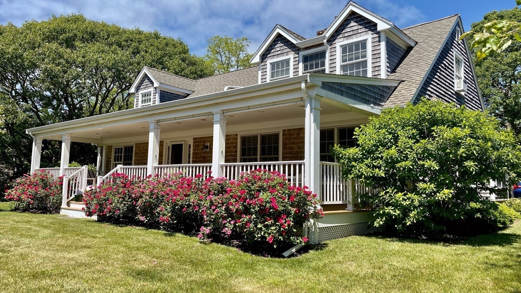 45 Bumblebee Hill Road Falmouth, MA 02540 - Photo 2 of 30 front view of a house with a yard