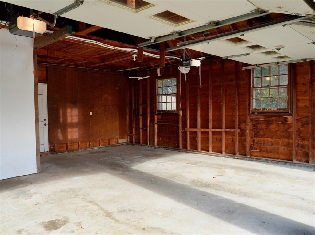 45 Bumblebee Hill Road Falmouth, MA 02540 - Photo 23 of 30 an empty room with wooden floor and windows