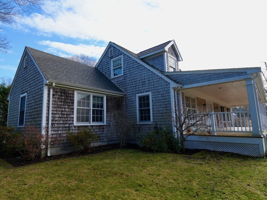 45 Bumblebee Hill Road Falmouth, MA 02540 - Photo 4 of 30 a view of a house with a garden