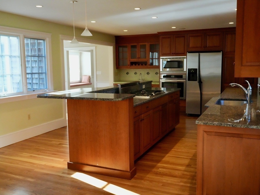 45 Bumblebee Hill Road Falmouth, MA 02540 - Photo 5 of 30 a kitchen with stainless steel appliances granite countertop a stove a sink a refrigerator and a microwave