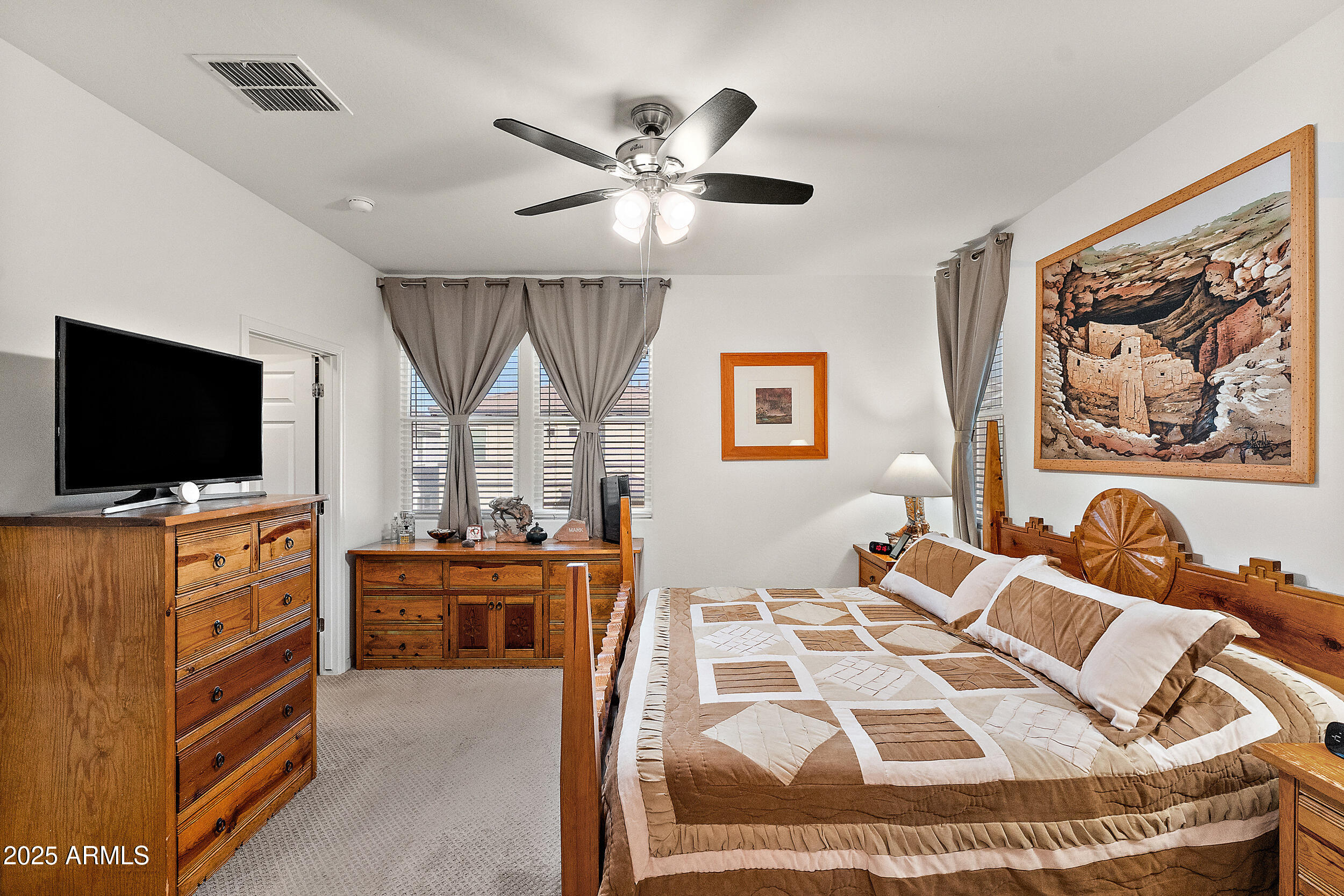 1921 West 22nd Avenue Apache Junction, AZ 85120 - Photo 14 of 38 a living room with furniture and a flat screen tv