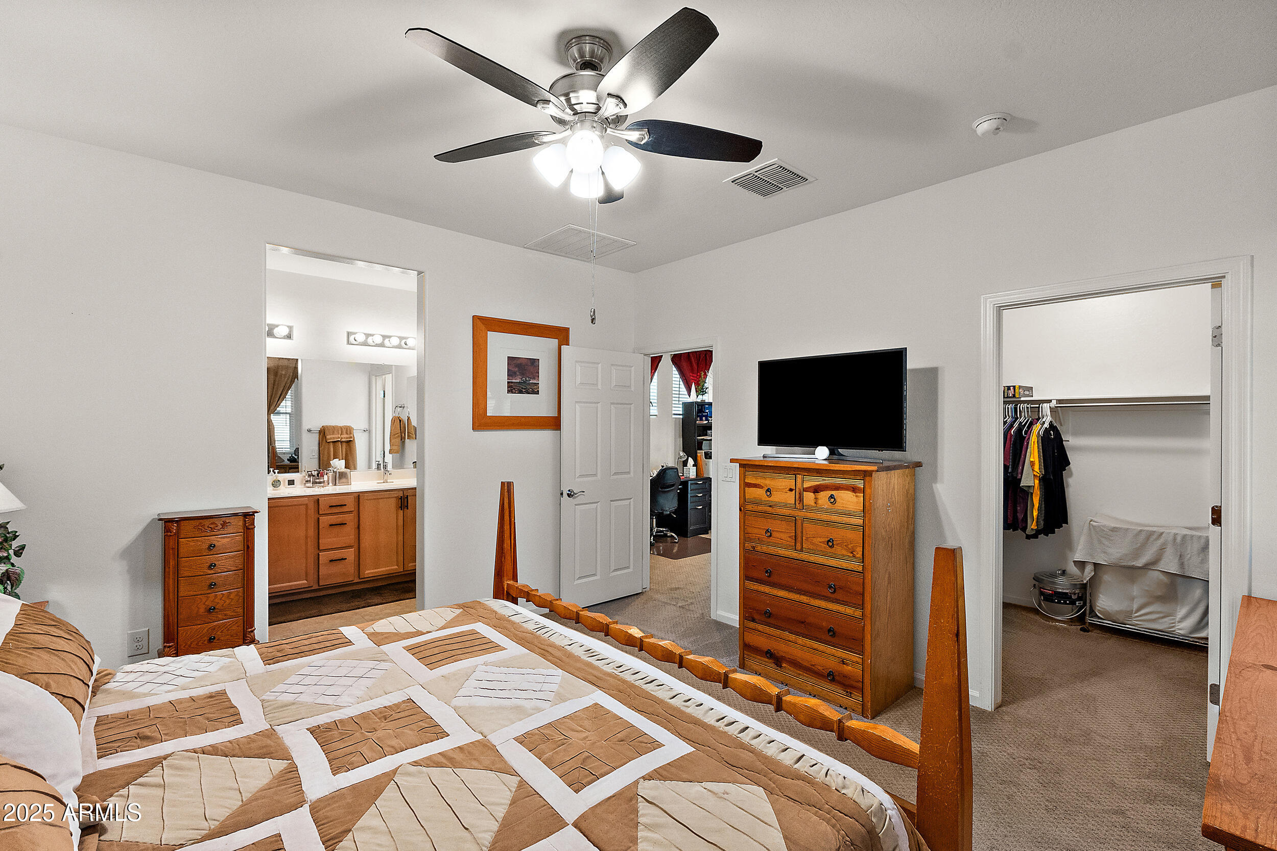1921 West 22nd Avenue Apache Junction, AZ 85120 - Photo 15 of 38 a bedroom with furniture and a flat screen tv
