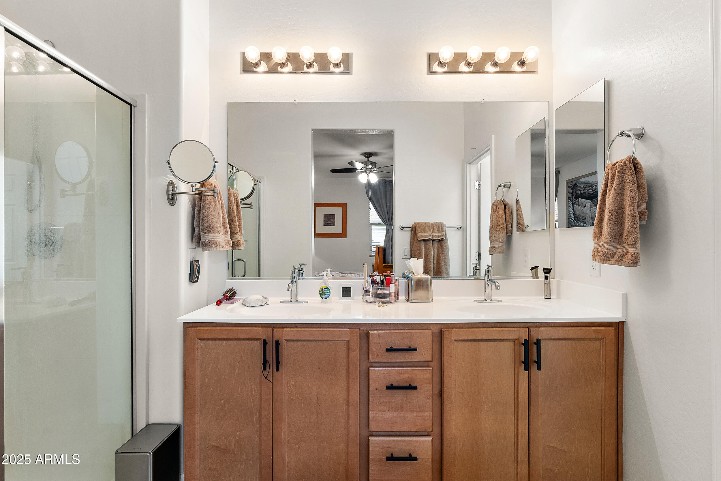 1921 West 22nd Avenue Apache Junction, AZ 85120 - Photo 16 of 38 a bathroom with a double vanity sink and a mirror