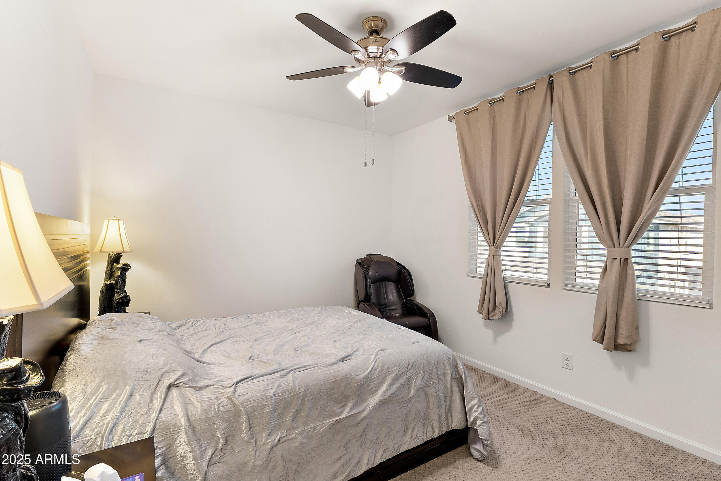 1921 West 22nd Avenue Apache Junction, AZ 85120 - Photo 19 of 38 a bedroom with a bed and a large window with wooden floor