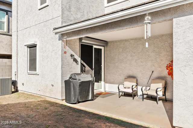 a lawn chairs sitting in a balcony