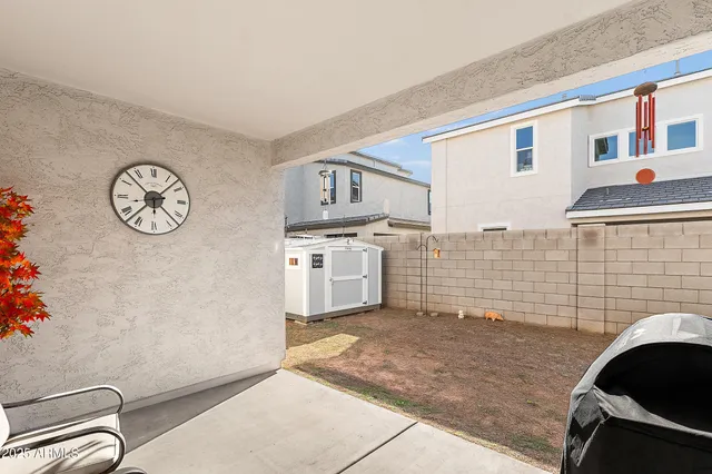 a view of a kitchen with fridge and wooden floor