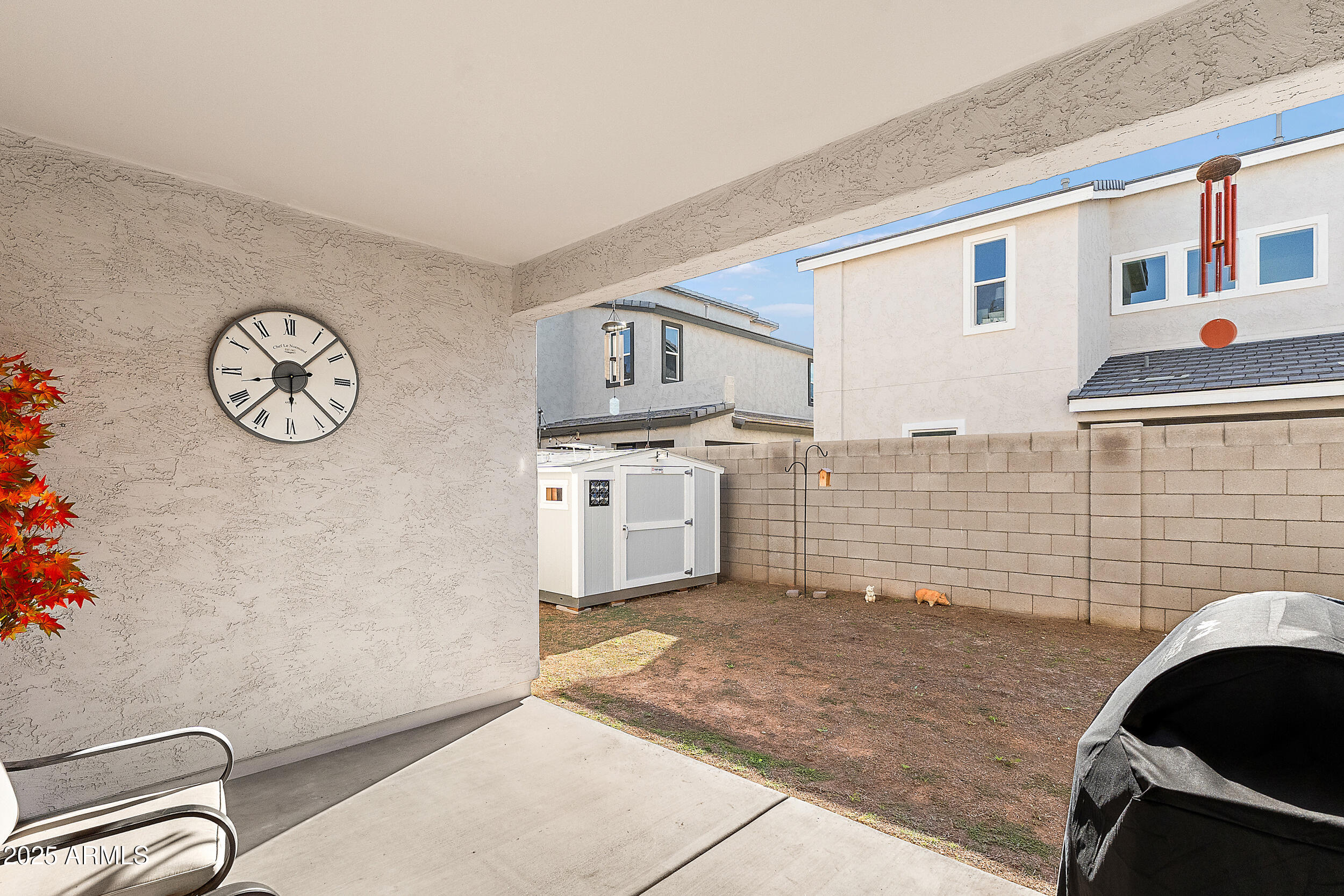 1921 West 22nd Avenue Apache Junction, AZ 85120 - Photo 25 of 38 a view of a kitchen with fridge and wooden floor