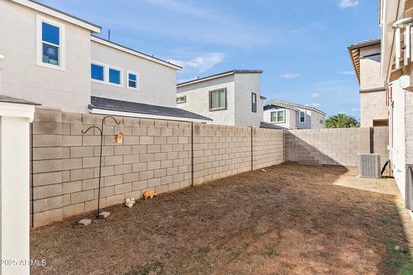 a view of a brick house with many windows