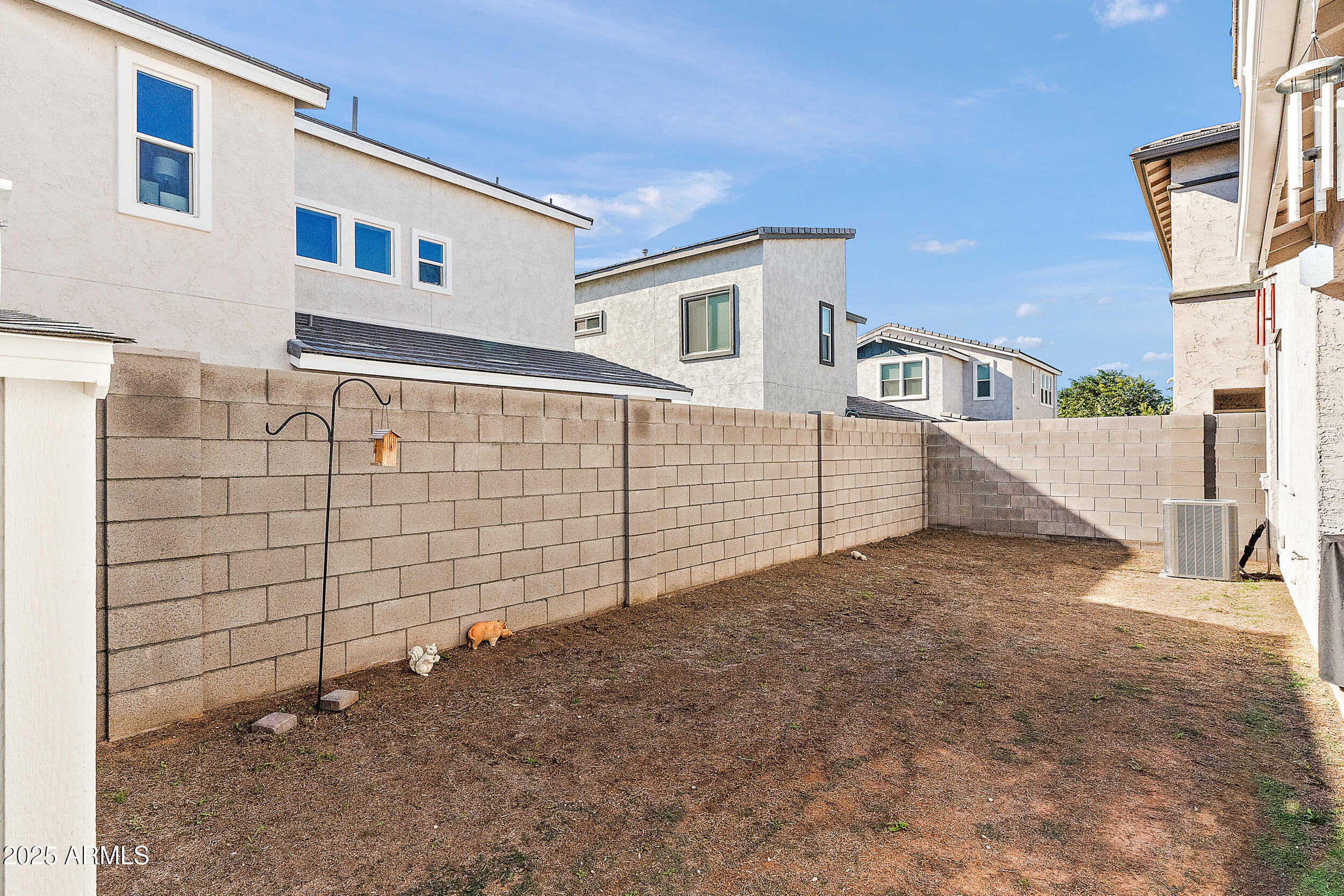 1921 West 22nd Avenue Apache Junction, AZ 85120 - Photo 27 of 38 a view of a brick house with many windows