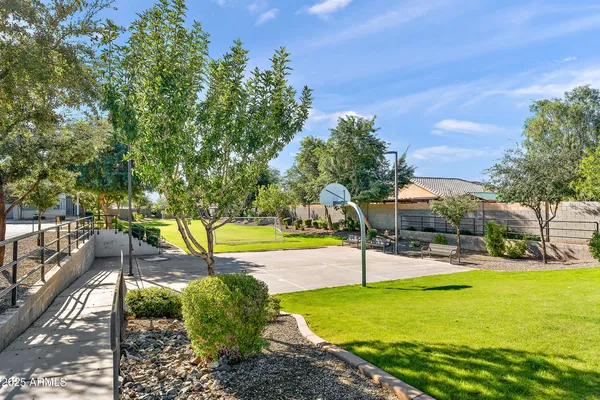 a view of a swimming pool with a patio