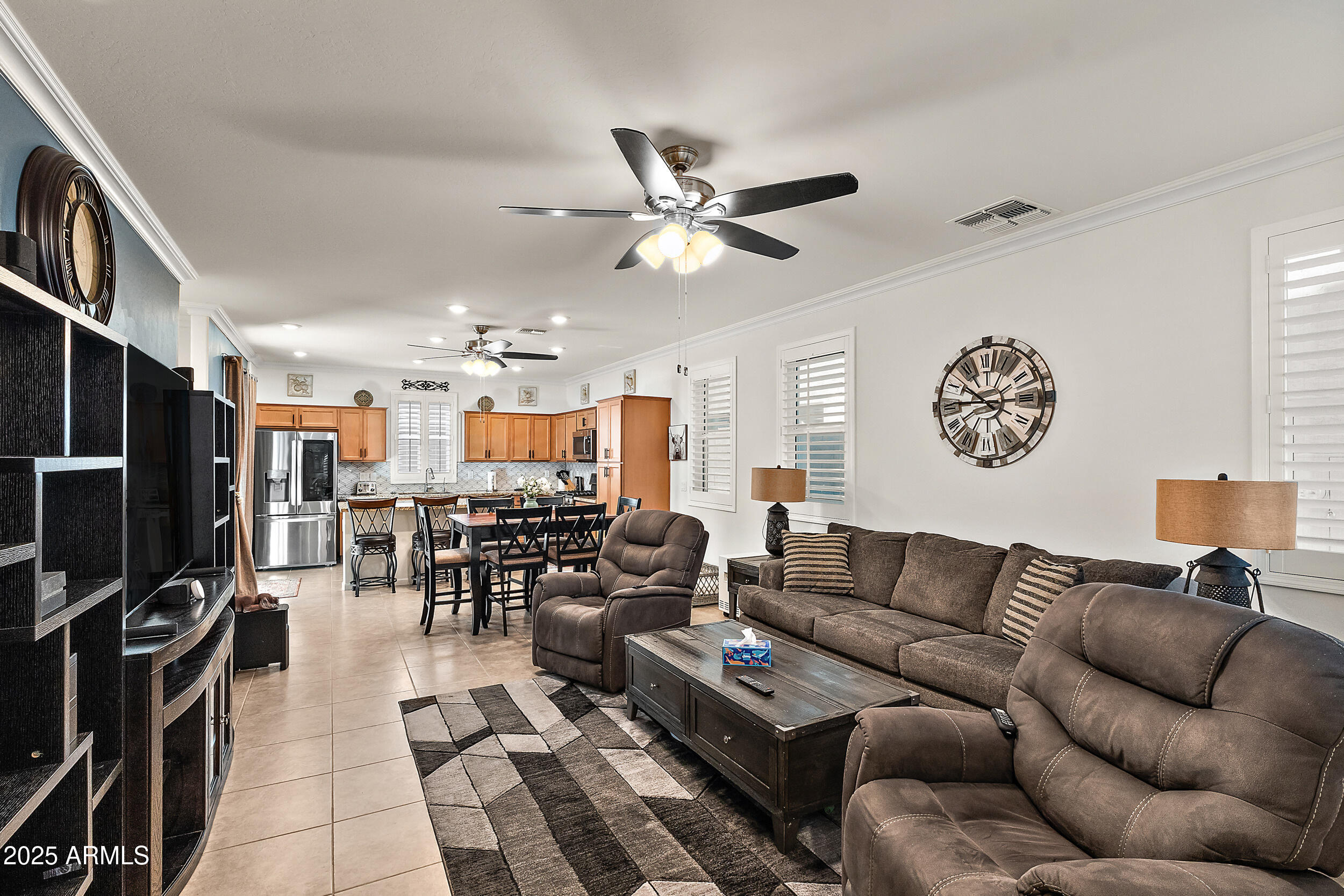 1921 West 22nd Avenue Apache Junction, AZ 85120 - Photo 5 of 38 a living room with furniture kitchen view and a large window