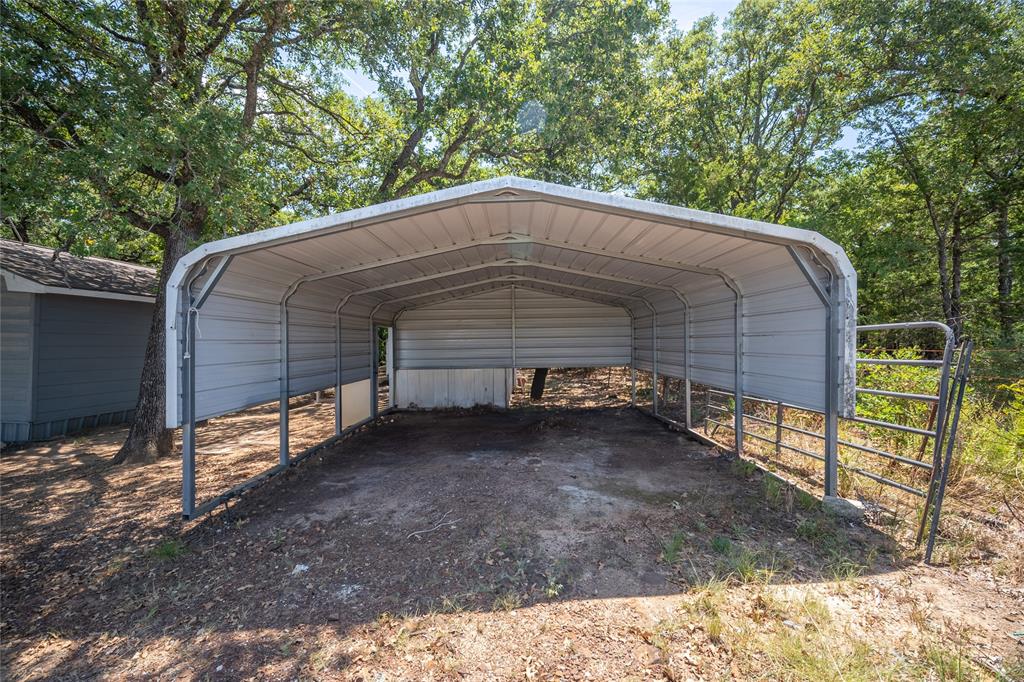 1285 Clark Road Gainesville, TX 76240 - Photo 17 of 20 The property includes a covered metal carport structure, providing sheltered parking