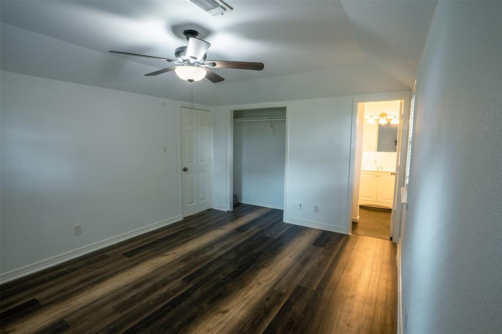 1285 Clark Road Gainesville, TX 76240 - Photo 3 of 20 This room features wood-look flooring and a ceiling fan with integrated lighting