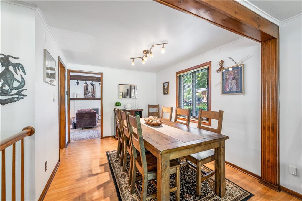 464 Sharon Road Coraopolis, PA 15108 - Photo 9 of 34 Welcome to the heart of the home! This inviting dining room offers the perfect blend of elegance and comfort, ideal for hosting family dinners or intimate gatherings.