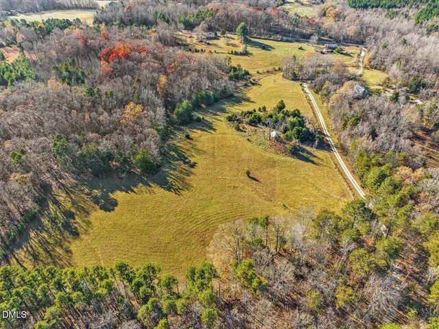 a view of a swimming pool with a yard