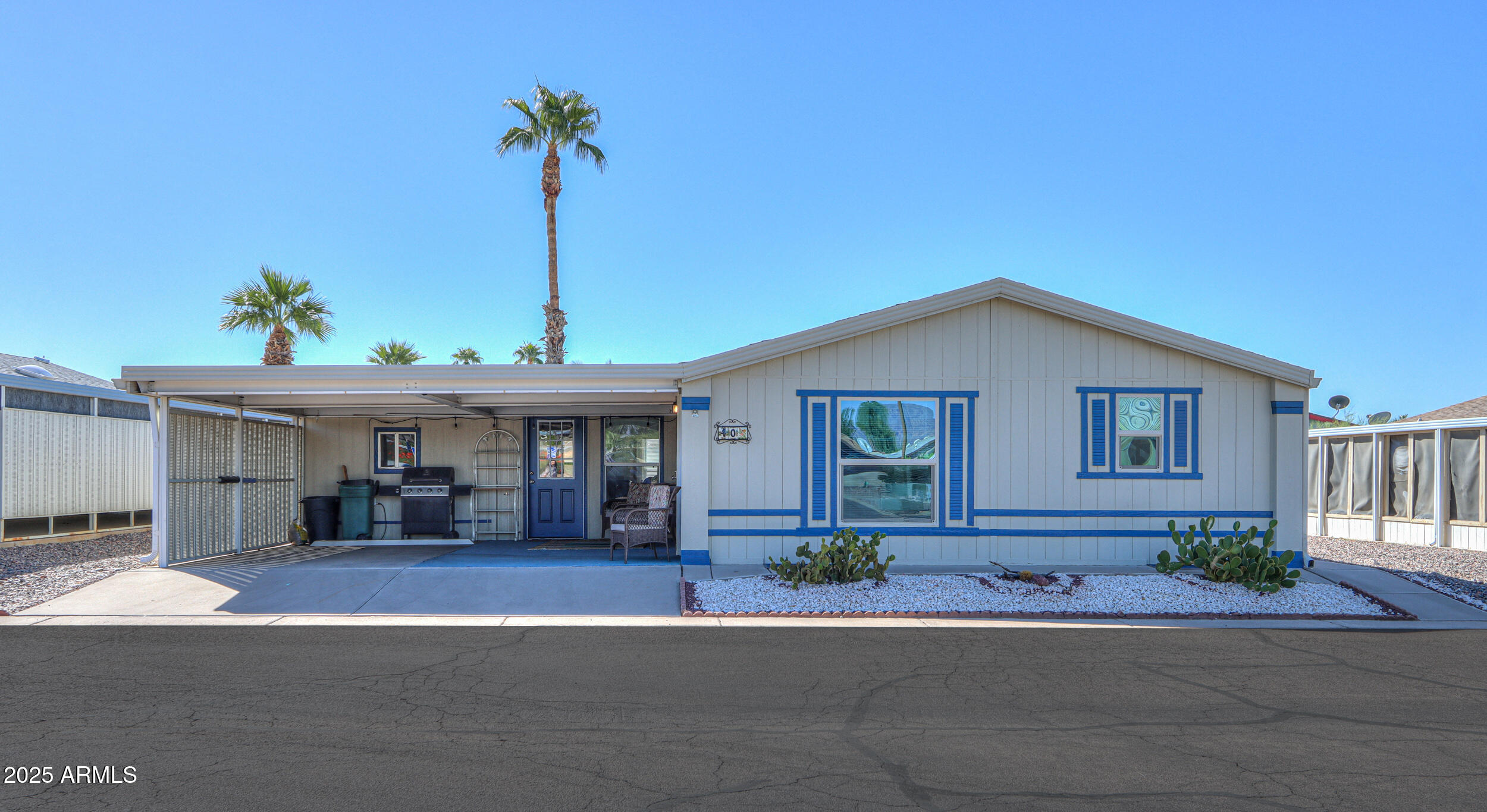 2208 West Baseline Avenue, Unit 40 Apache Junction, AZ 85120 - Photo 1 of 30 a front view of a house with a yard