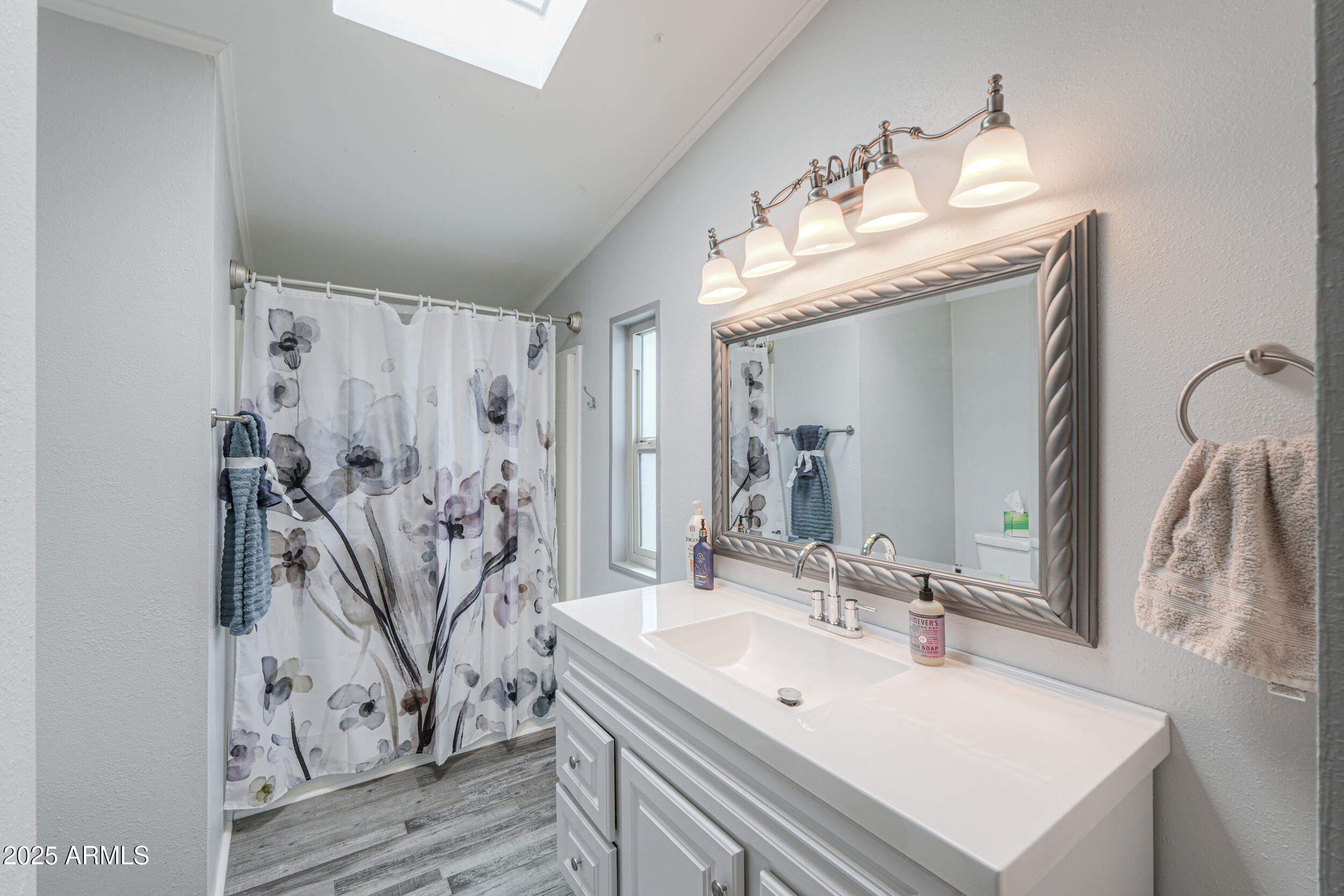 2208 West Baseline Avenue, Unit 40 Apache Junction, AZ 85120 - Photo 14 of 30 a bathroom with double vanity sink and mirror