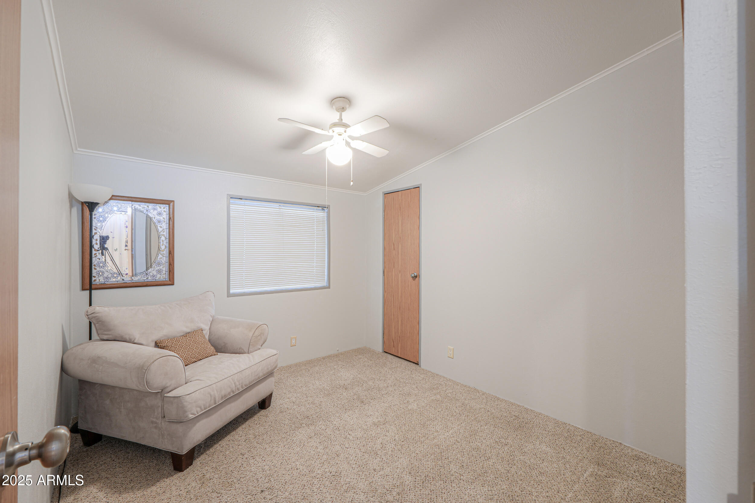 2208 West Baseline Avenue, Unit 40 Apache Junction, AZ 85120 - Photo 16 of 30 a living room with furniture and a ceiling fan