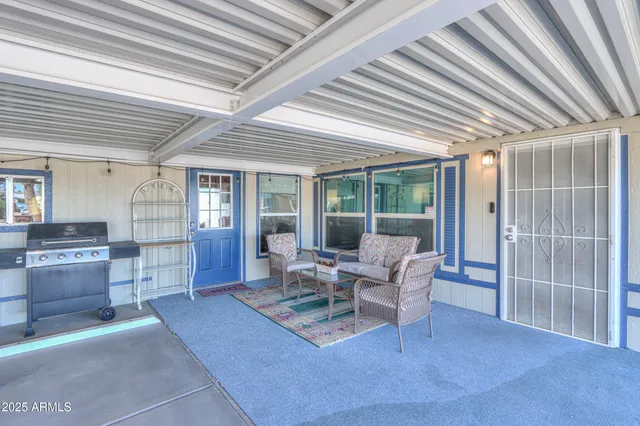 a living room with furniture and a window